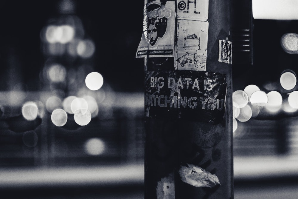 A sticker on a post that reads, 'Big data is watching you.'